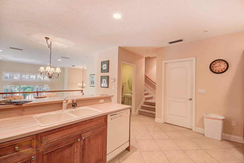 Gourmet Kitchen & Dining Area – Fully equipped with full-size appliances, granite countertops, and open-concept layout