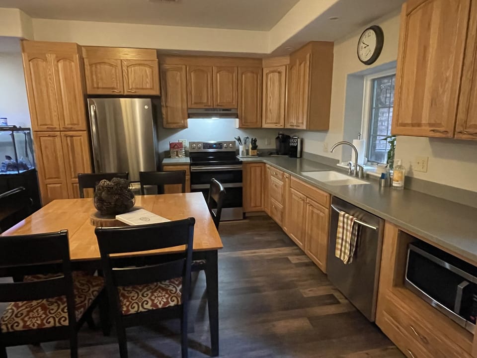 Kitchen with fridge, dishwasher and microwave