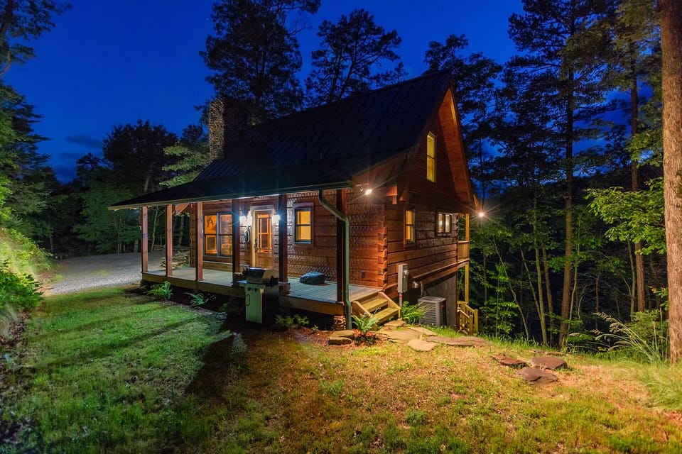 The night time glow of Chimney Rock Cabin evokes the feelings and peace of a simpler era.