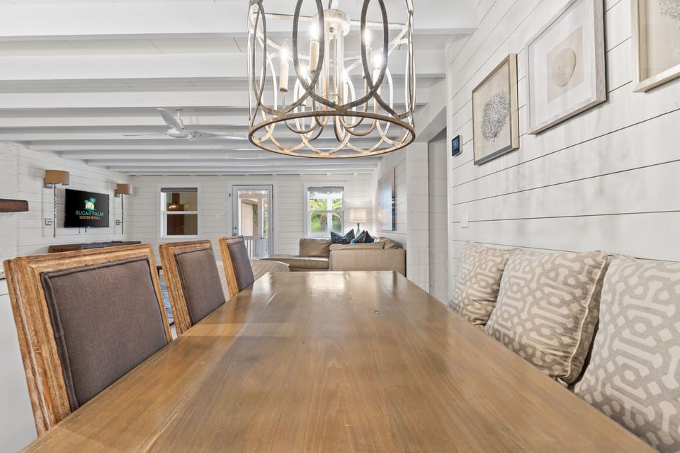 Bright, airy dining area with coastal vibes and modern rustic touches.