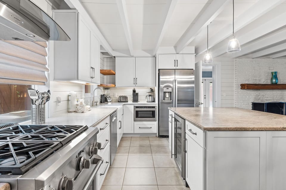 Remodeled kitchen is simply stunning with leathered granite counters.