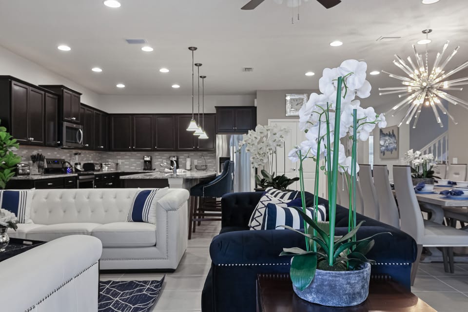 View 3 of spacious living room and kitchen area with comfortable seating