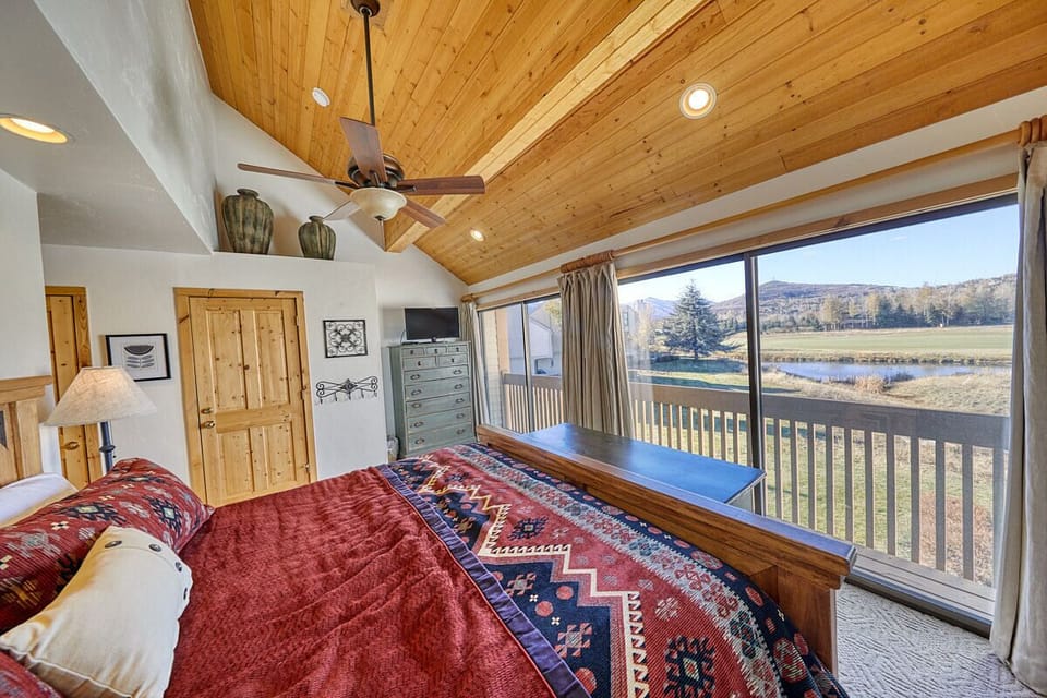 Master bedroom with floor to ceiling windows and juliet balcony.