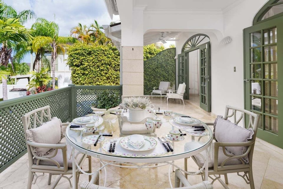 Spacious terrace via French doors, with sitting and dining areas
