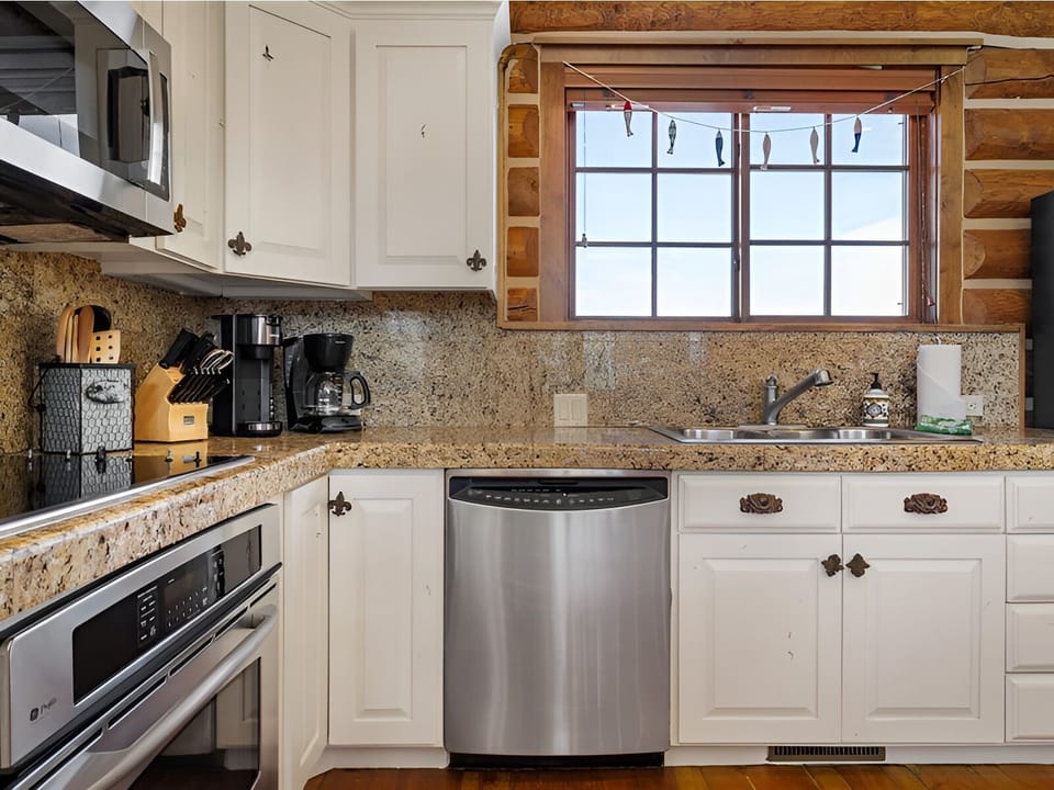 Prep fresh breakfasts on granite counters with full cookware nearby.