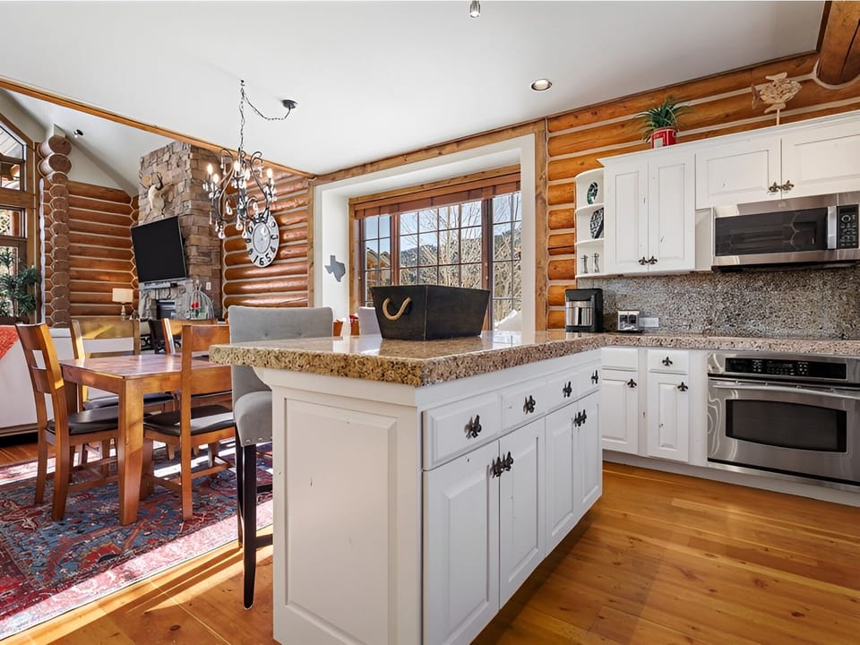 Savor morning coffee in the sunlit kitchen with big island.