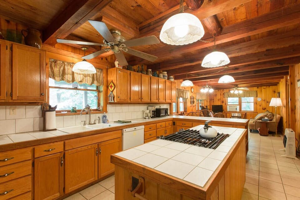 Large kitchen, laundry room to the right, and a unique half bath.