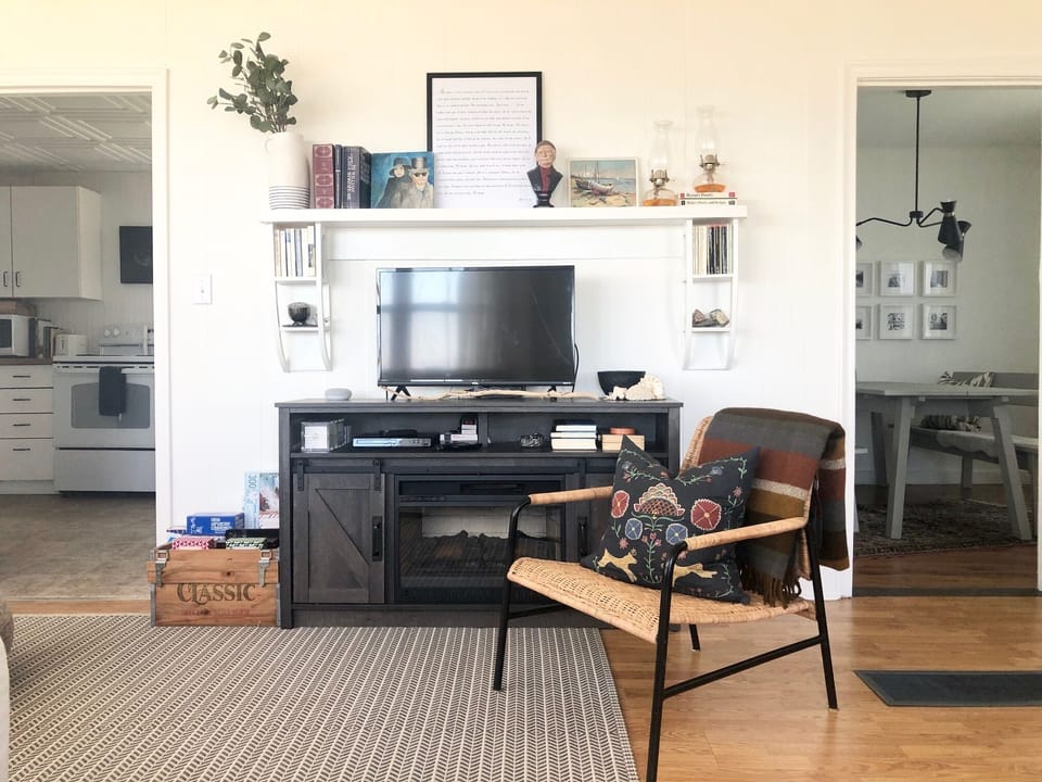 living room with fireplace, board games, books, TV, Netflix, DVDs & game console