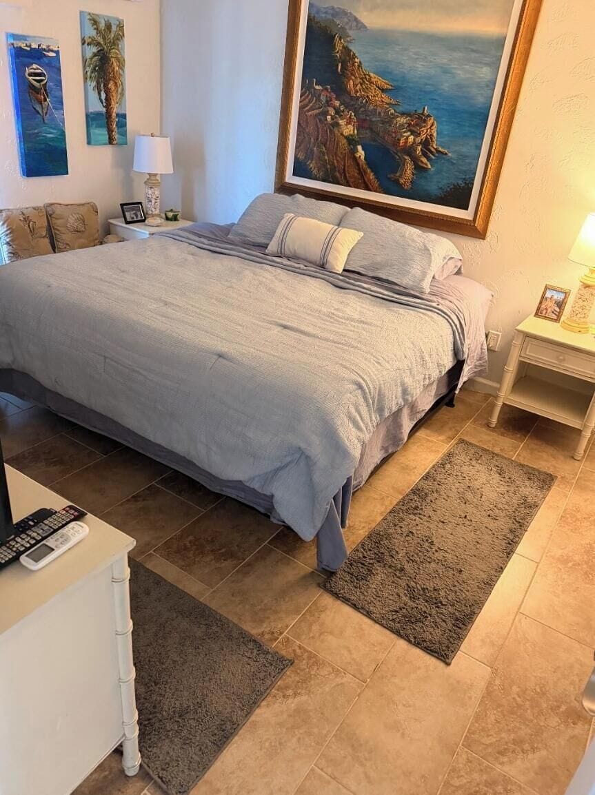 King bed in master bedroom with bathroom attached. TV, quiet mini split hvac