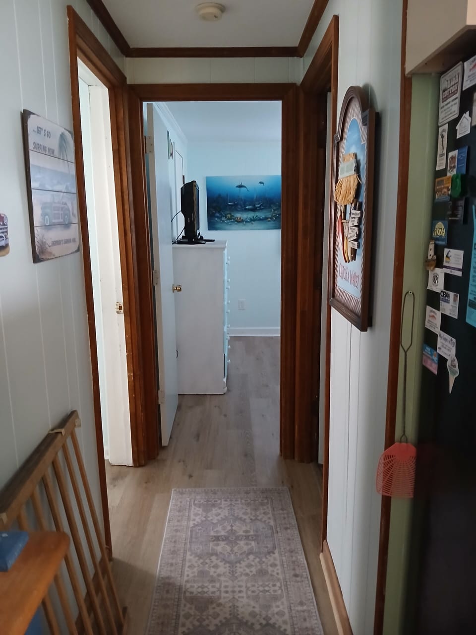 Hallway to back bedrooms and hall bath.
