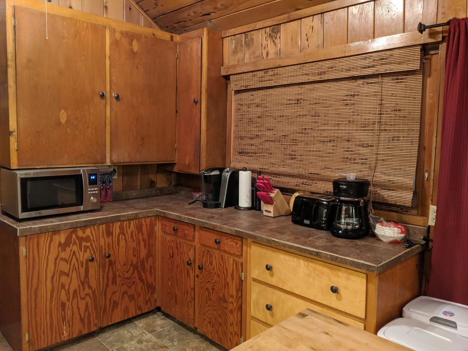Kitchen includes Microwave Oven, knives, toaster, 2 different coffee pots.