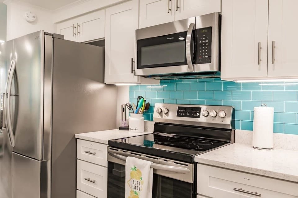 Beautiful Kitchen with Stainless Steel Appliances and Quartz Countertops
