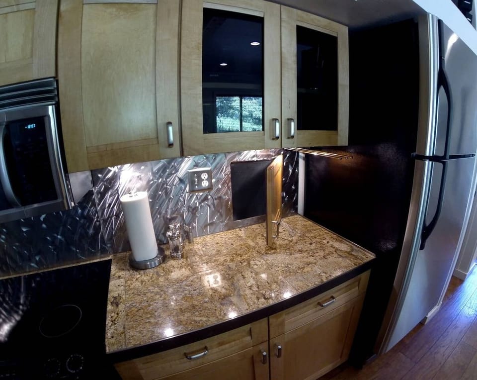 That door is a garbage chute. No need to take it out It lands in a 44-gallon bag