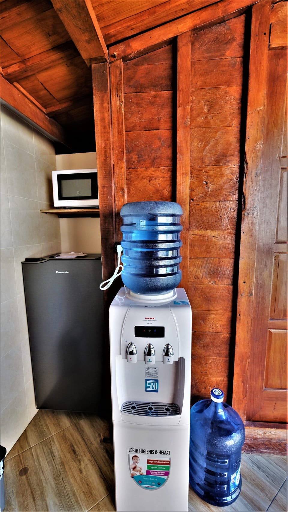 refrigerator, microwave, and free flow drinking water on dispenser