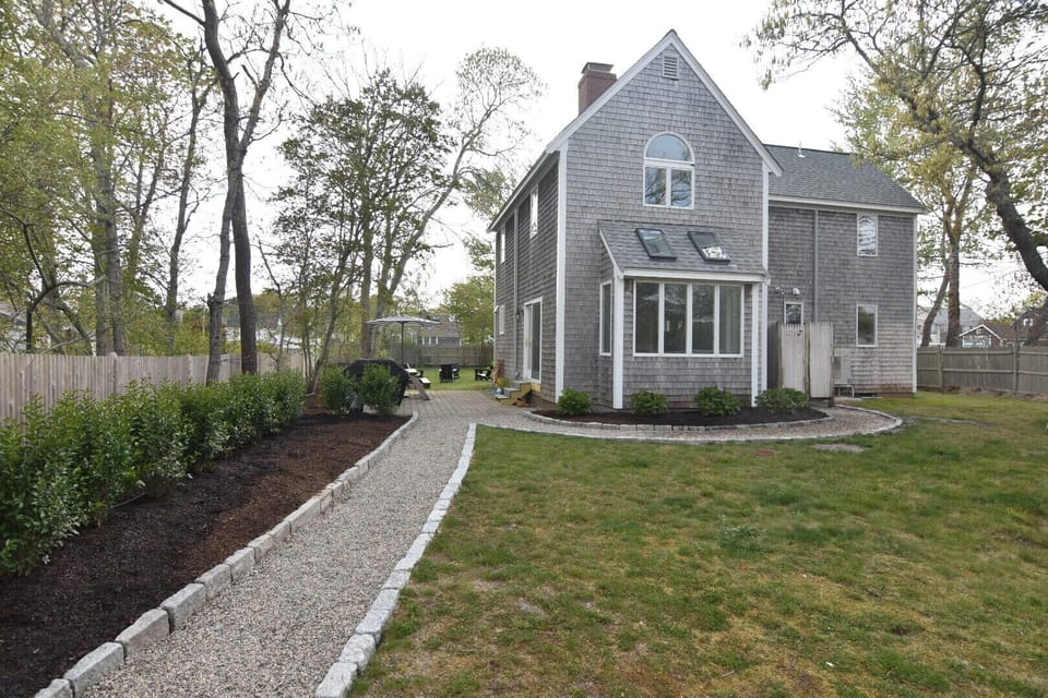 Large spacious yard, new walkways, patio w/new Weber grill, outdoor shower