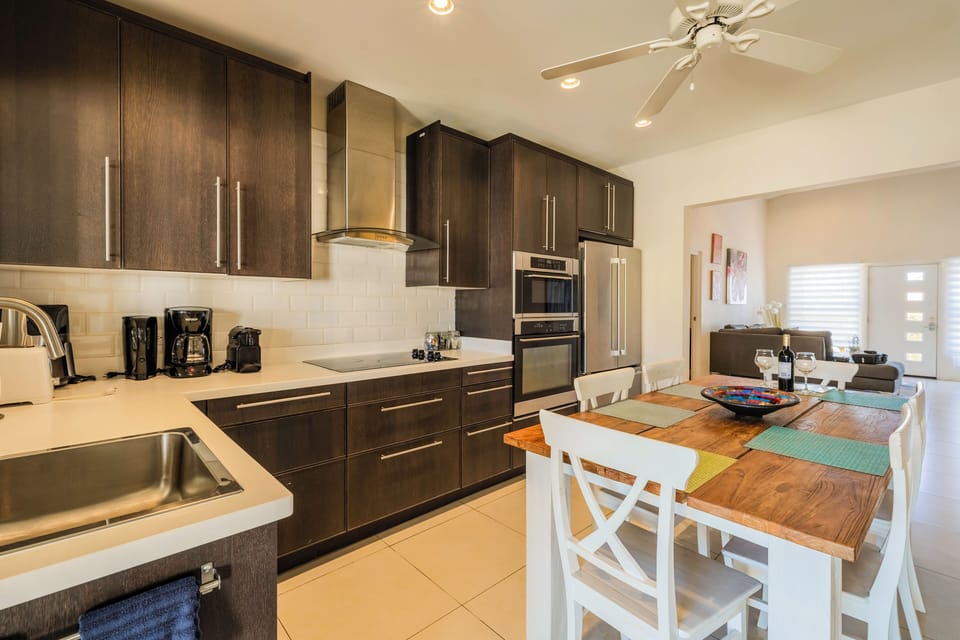 Modern kitchen with all the appliances including a dishwasher