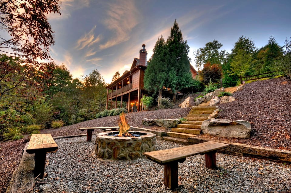 Outdoor landscape and professionally hardscaped with boulders and evergreens