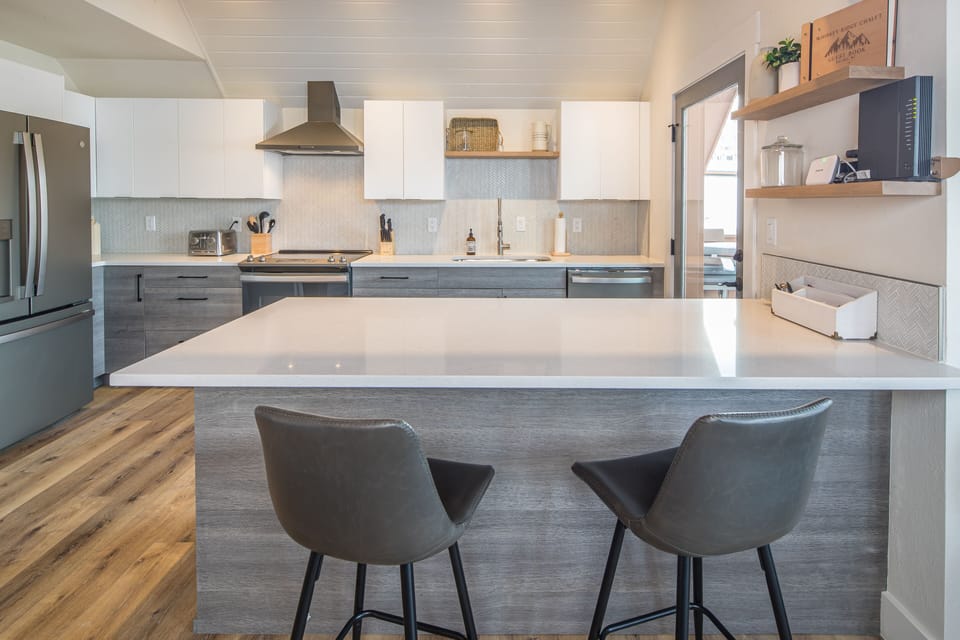 Fully Stocked Designer Kitchen with Doorway Out to New View Deck