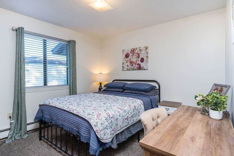 Queen bed with desk and chair