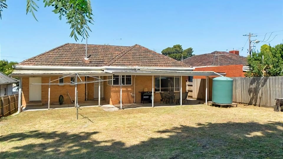 Enjoy the space of a generous sized fully enclosed back yard with ample lawn space for kicking around a ball.