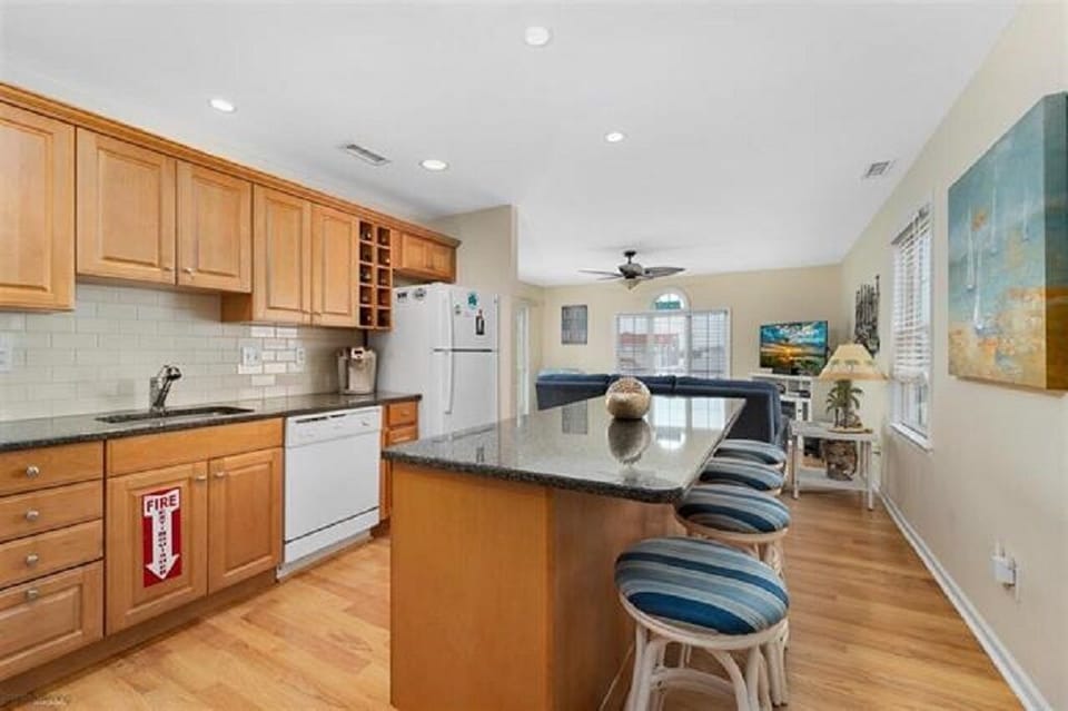 Kitchen with extra seating at island. Four stools. 
