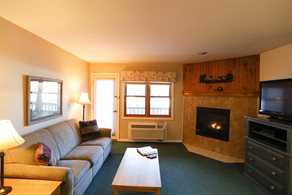 Living Room with Patio and Gas Fireplace in Vacation Condo
