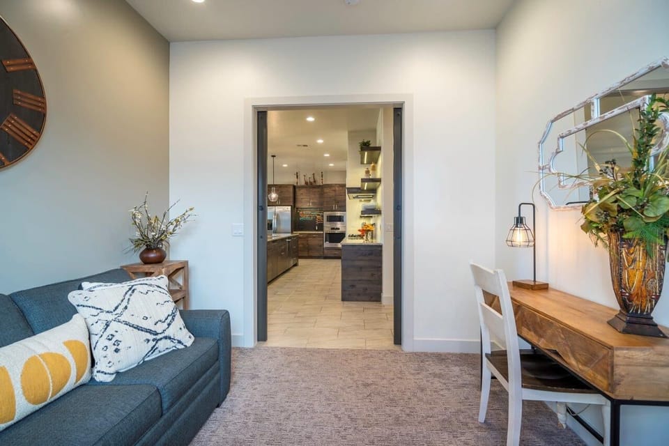 Den located off the kitchen with a queen sofa sleeper