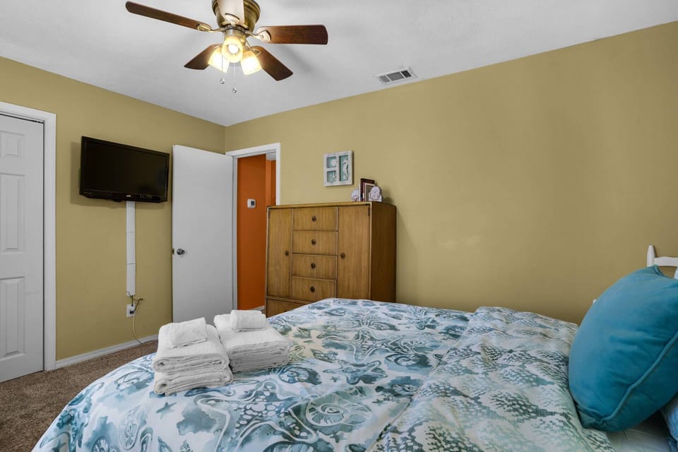 The guests bedroom also has a mounted tv and plenty of closet space.