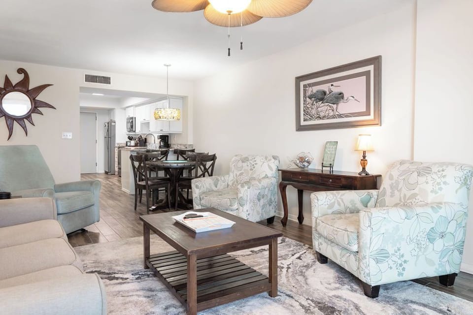 Living Area - Welcome home to comfort! Unwind in the spacious living area featuring a cozy sofa sleeper and plenty of seating—your perfect haven for a relaxing stay.
