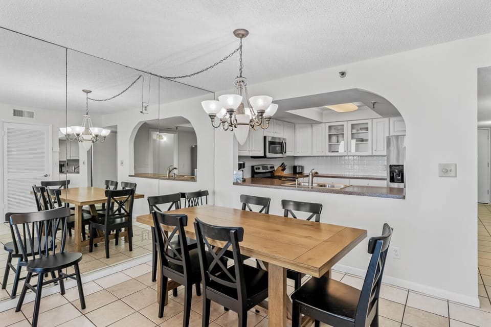 Your spacious dining area flows seamlessly into the fully-equipped kitchen, perfect for gathering around warm meals with family and friends.