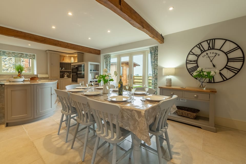 Ground floor: Dining area with table and seating for eight