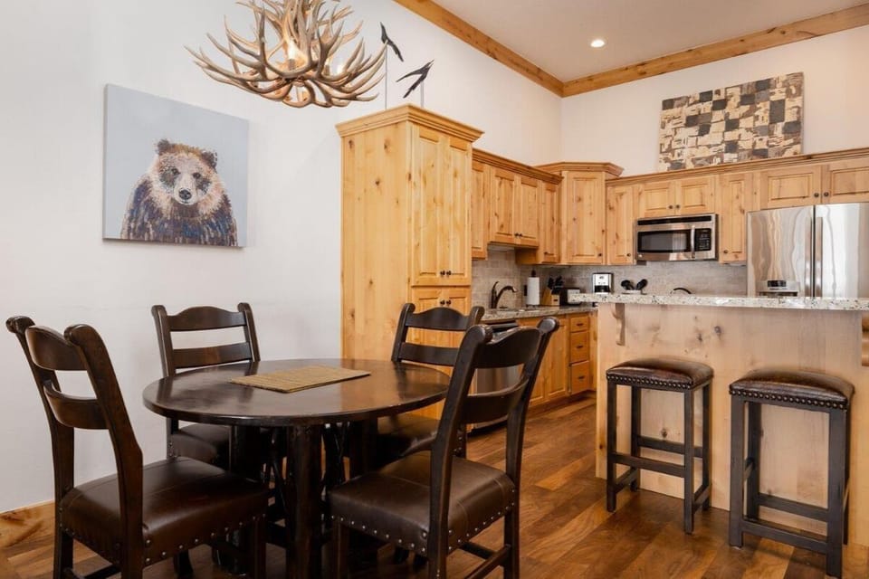 Share cozy dinners under rustic lighting after mountain adventures.