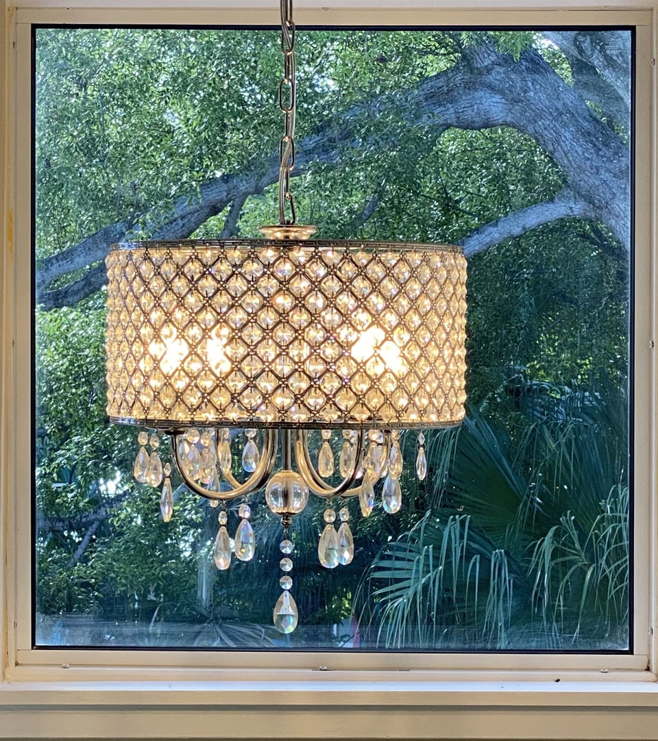 Chandelier at the top of the stairs 