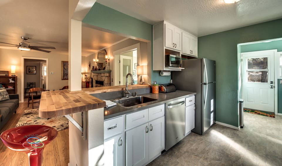 Newer kitchen with quartz counters and stainless steel appliances