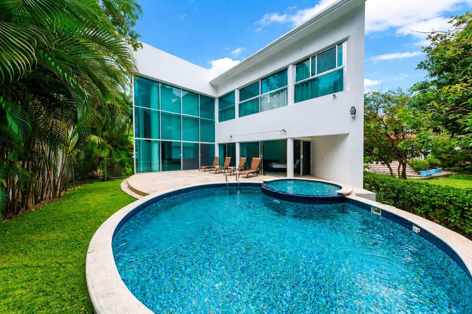 Your private pool surrounded by lush gardens.
