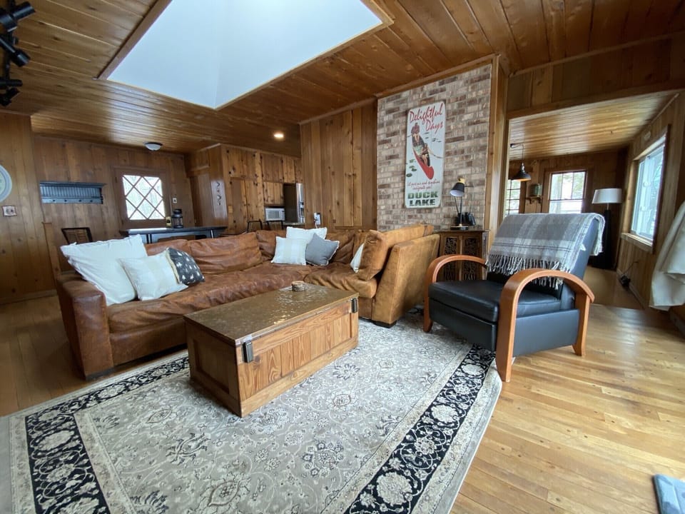 Sitting Room with TV and sliding door to the deck