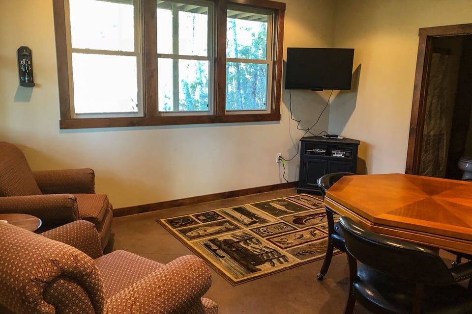 The family room on the lower level has a poker table and satellite TV