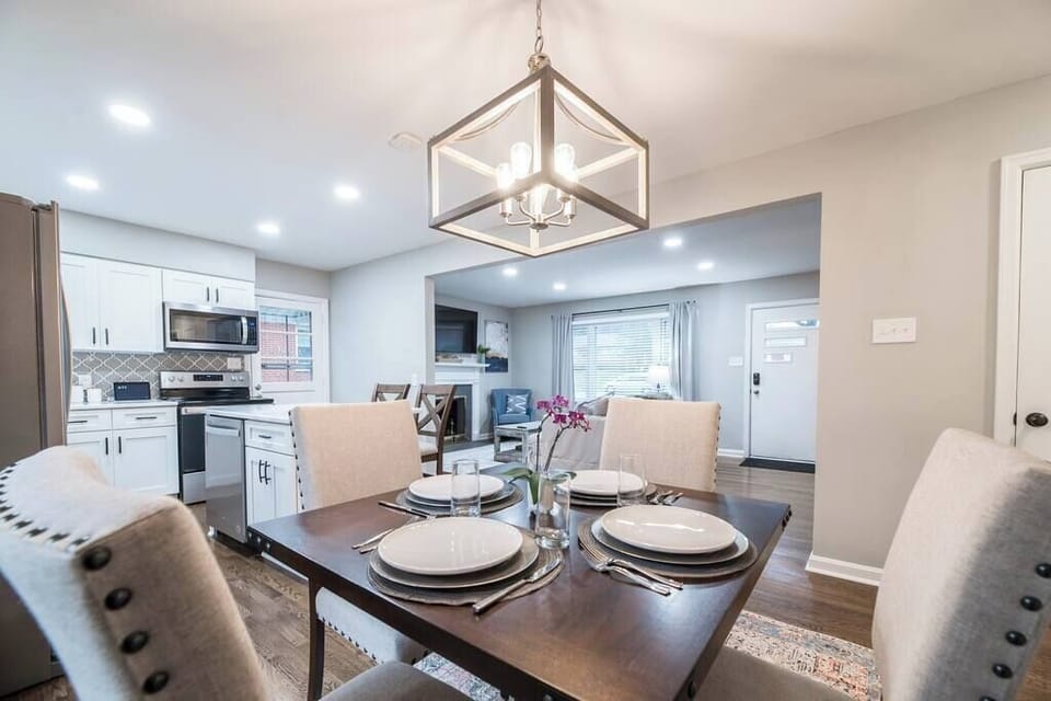 Pull
up a chair at
the dining table
for four, set
beneath a
statement
chandelier that
makes even a
quick breakfast
feel special.
