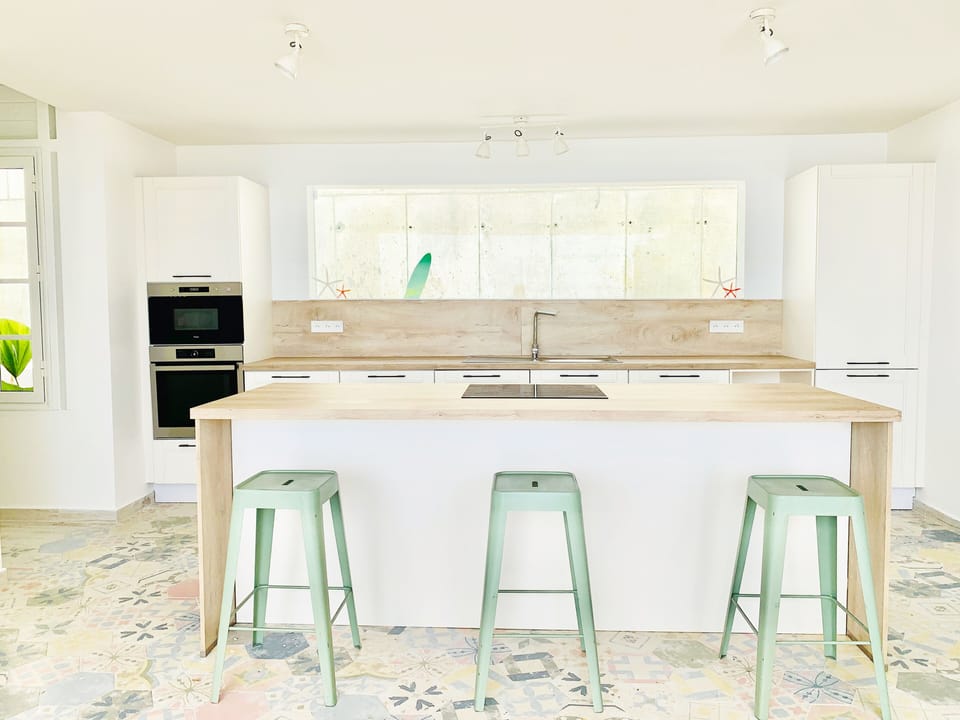 An island kitchen centrally located in the home with an amazing view.