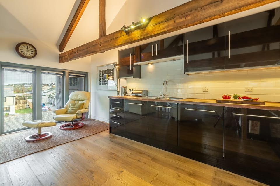 Copperhouse View, Hayle. First floor: Open-plan kitchen leading to seating area