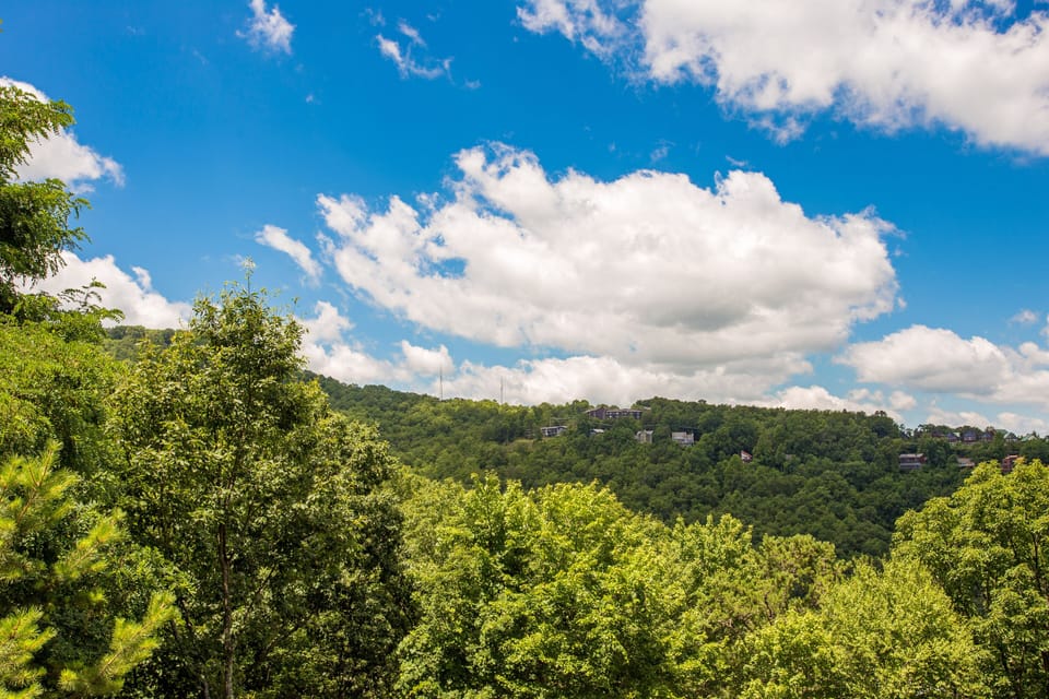 Clouds drifting over green mountain views from the upstairs deck.