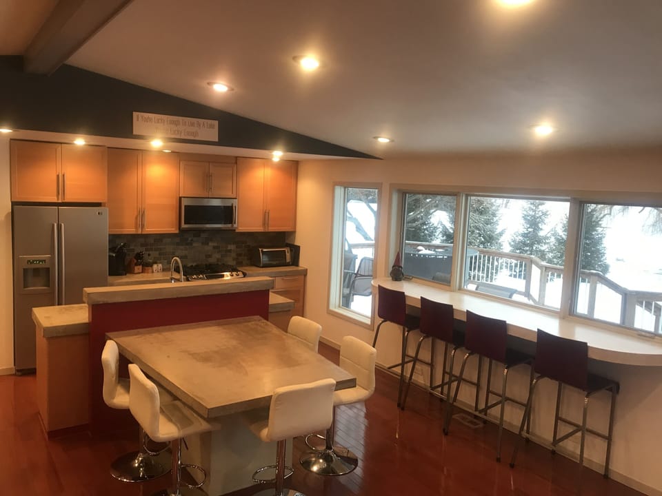 Dining Area, Kitchen and Snack Bar.  Great Open Concept and Great Lake Views!!