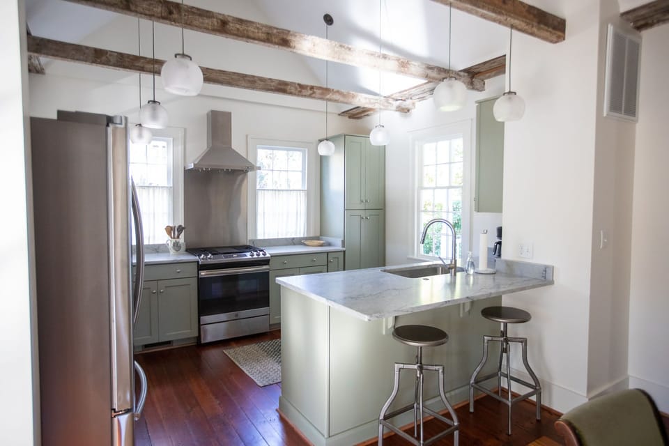 Well appointed kitchen with gas range and hood.