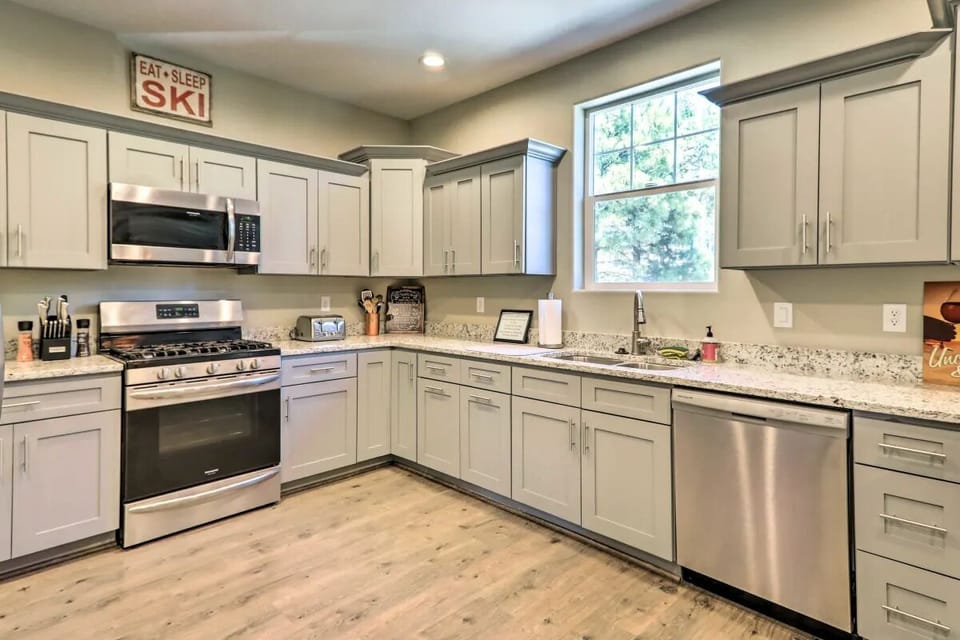 Fully stocked kitchen with gas stove and oven