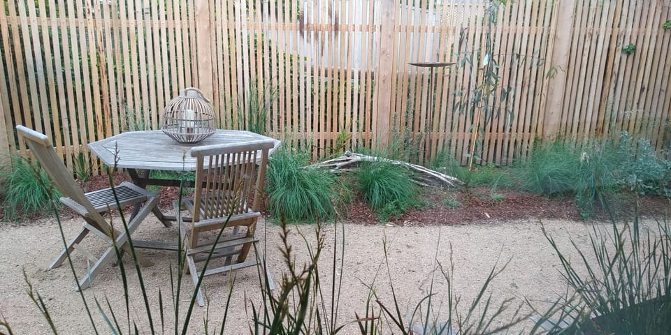 Private native garden viewed from kitchen/dining area.