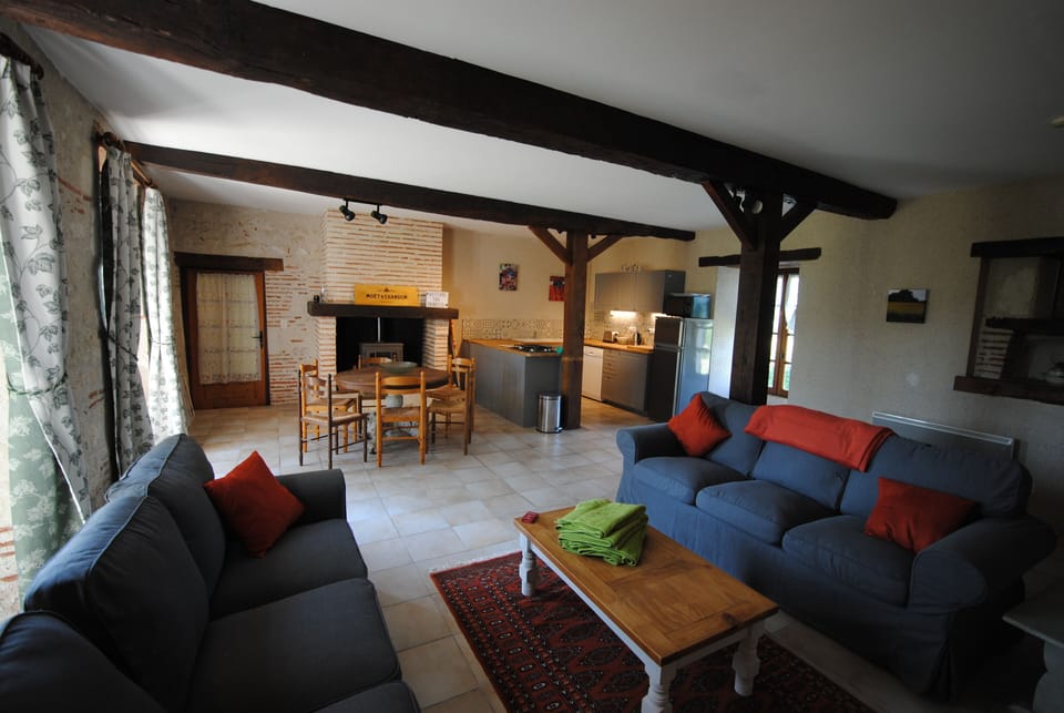 open plan living area with a fully fitted kitchen