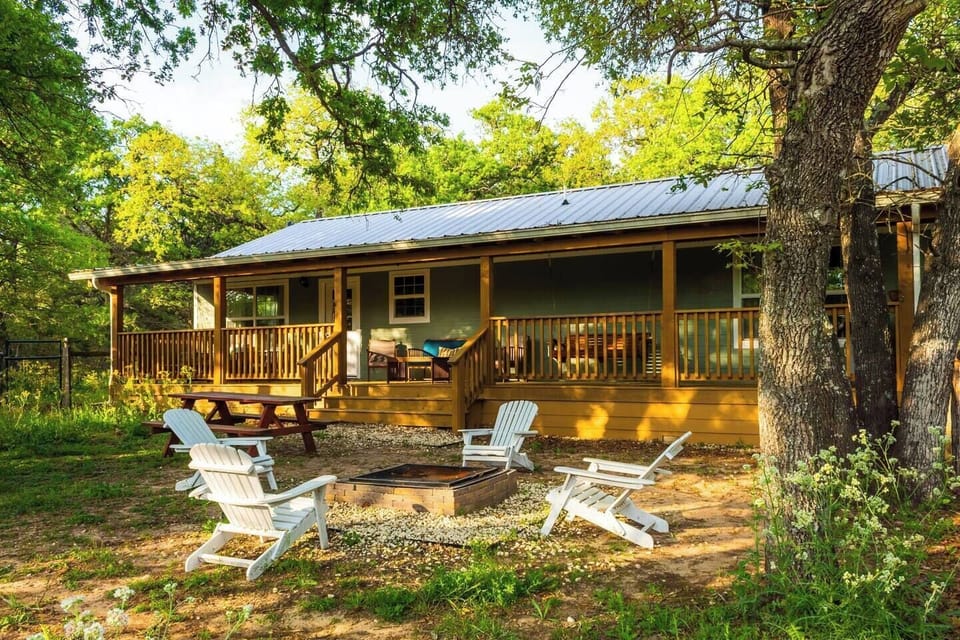Fenced backyard with firepit and amazing porch