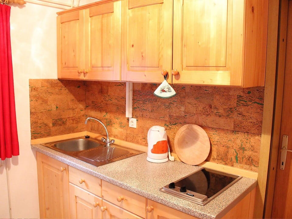 Countertop, Room, Property, Kitchen, Sink, Furniture, Cabinetry, House, Tile, Wood