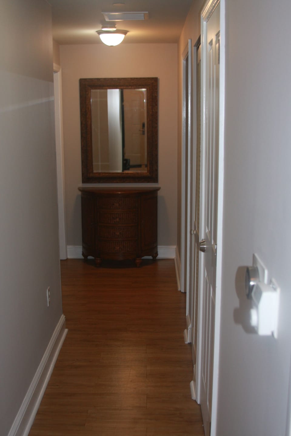 View from front door looking towards two guest bedrooms and guest bathrooms