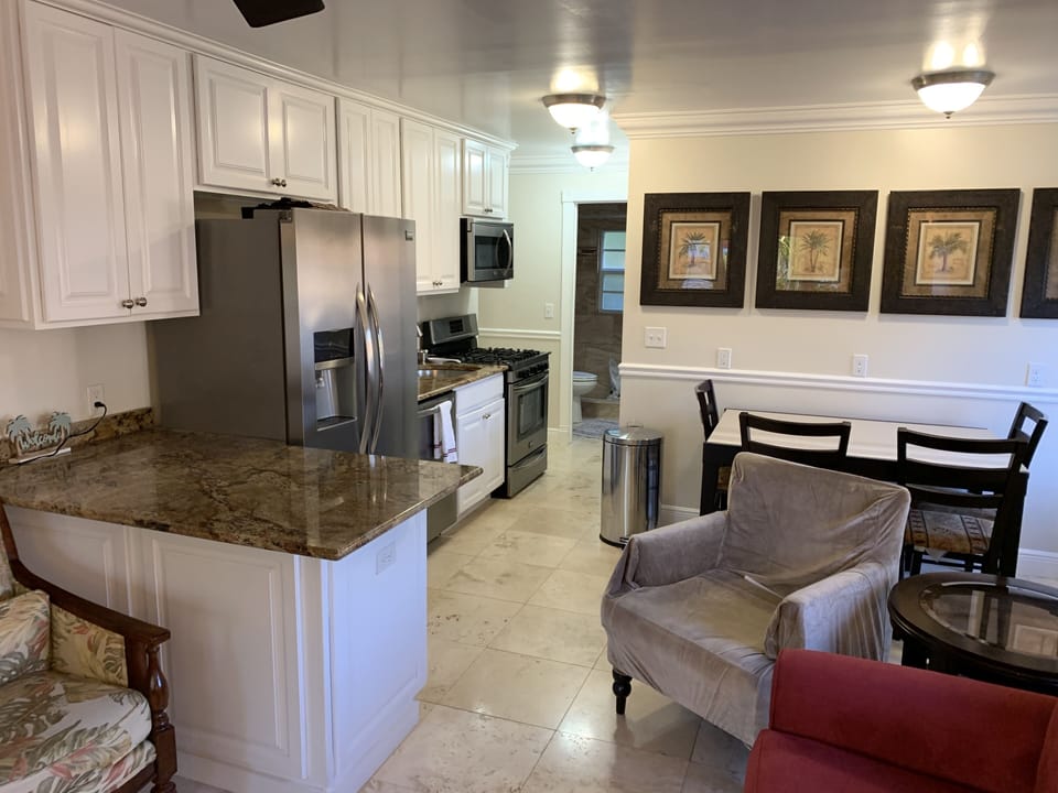 Kitchen marble countertops, stainless steel appliances, gas stove 
